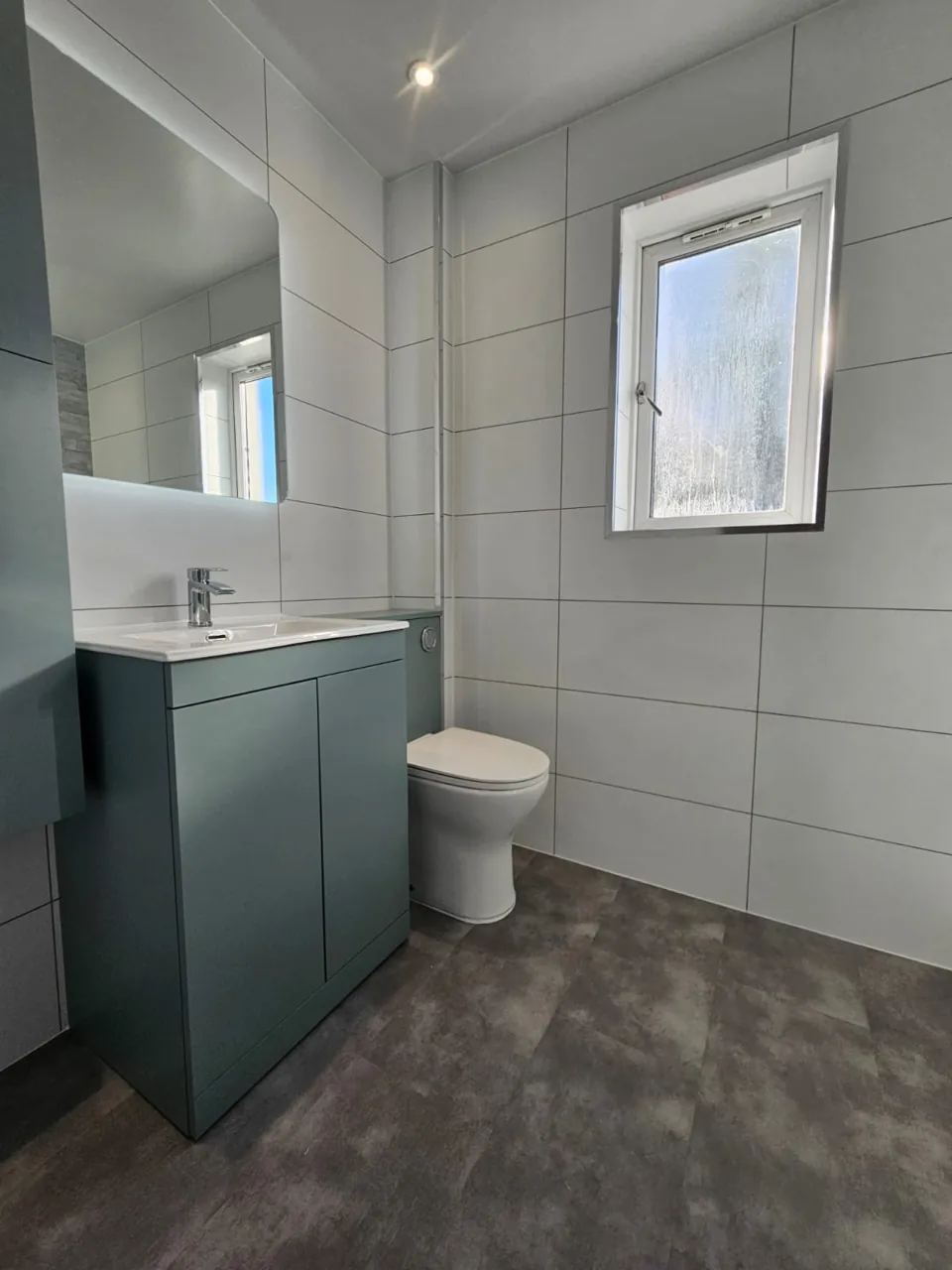 Blue-grey vanity, basin and matching toilet unit